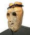 Three-quarter angle of ancient West Mexican bone mask pendant showing nose ridge and eye sockets