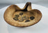 Historic Carthaginian oil lamp featuring folded rim design and group of bronze coins