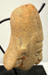 Right profile of terracotta head sculpture showing ear detail and angular nose structure