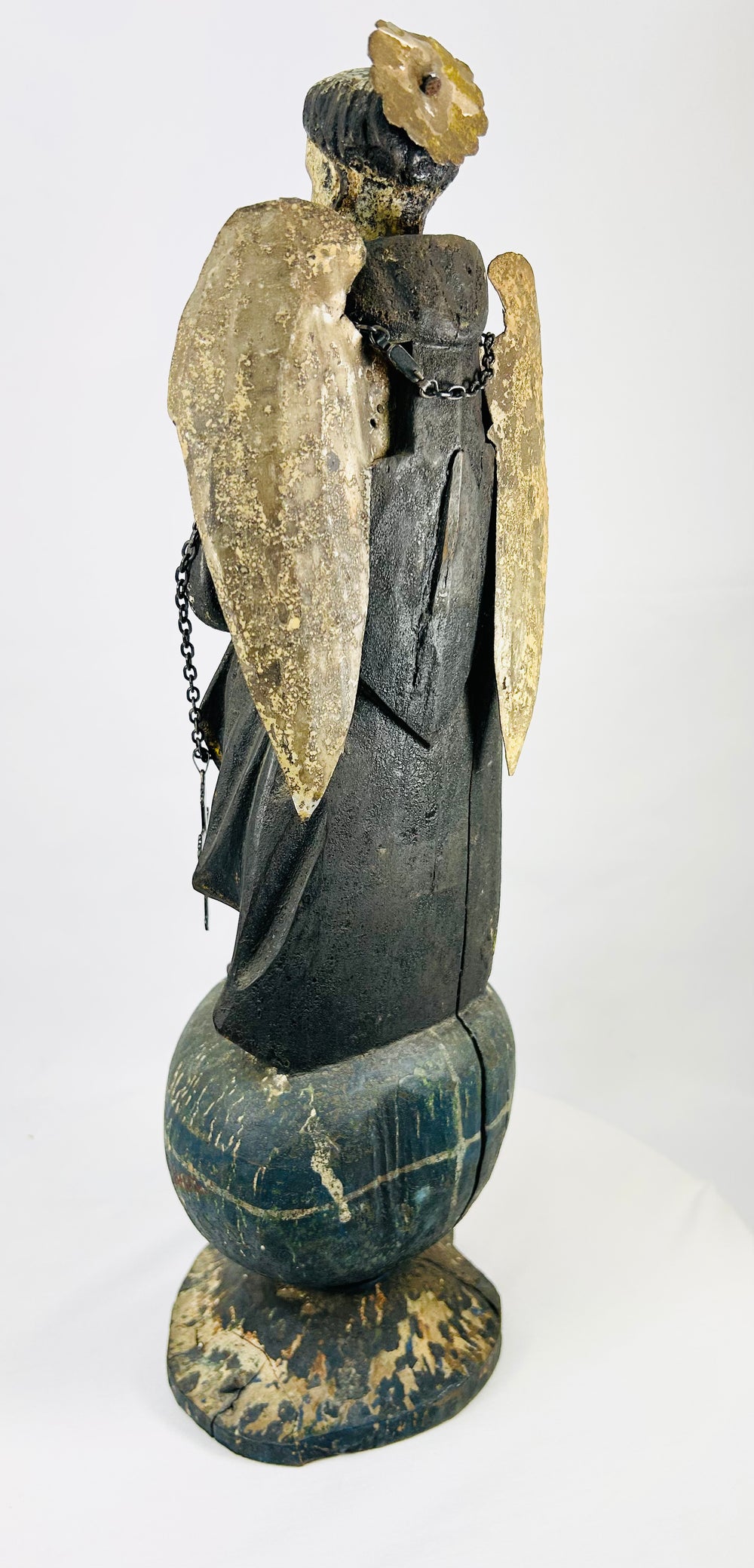 Colonial Latin American folk-religious polychrome wooden angel, 18th–19th century, orb base