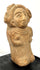 Ancient Mexican terracotta female figure with a broad flaring headdress, rounded body, and detailed ceremonial adornments.