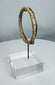 Historic Roman glass jewelry artifact with raised decorative elements and complete form.