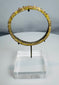 Authentic Roman glass bracelet featuring raised nodular ornamentation and archaeological patina.