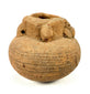 Side view of brown clay vessel with horizontal incised dot patterns