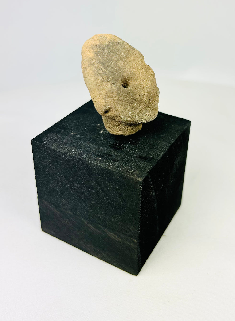 Pre-Columbian terracotta head fragment, West Mexico, drilled eyes, rounded features, Nayarit or Jalisco, 300 BCE–300 CE