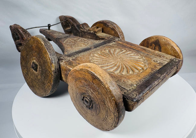 Historic hand-carved wooden processional cart likely originating from India