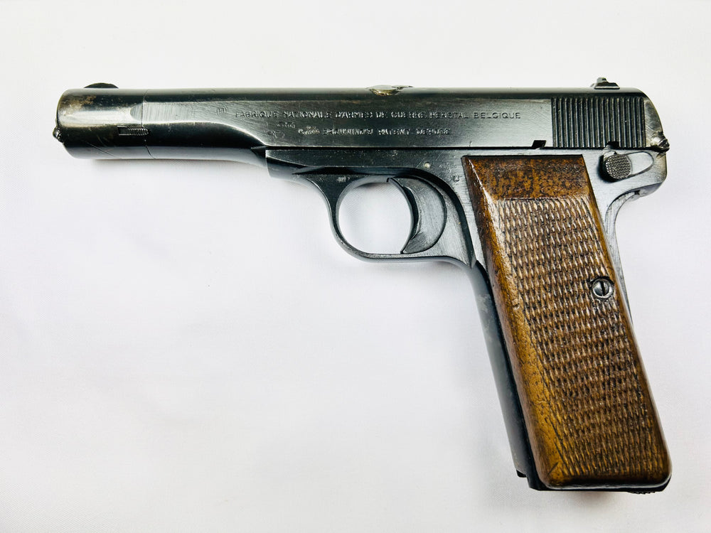 World War II Belgian Browning FN Model 1922 pistol with walnut grips and engraved markings