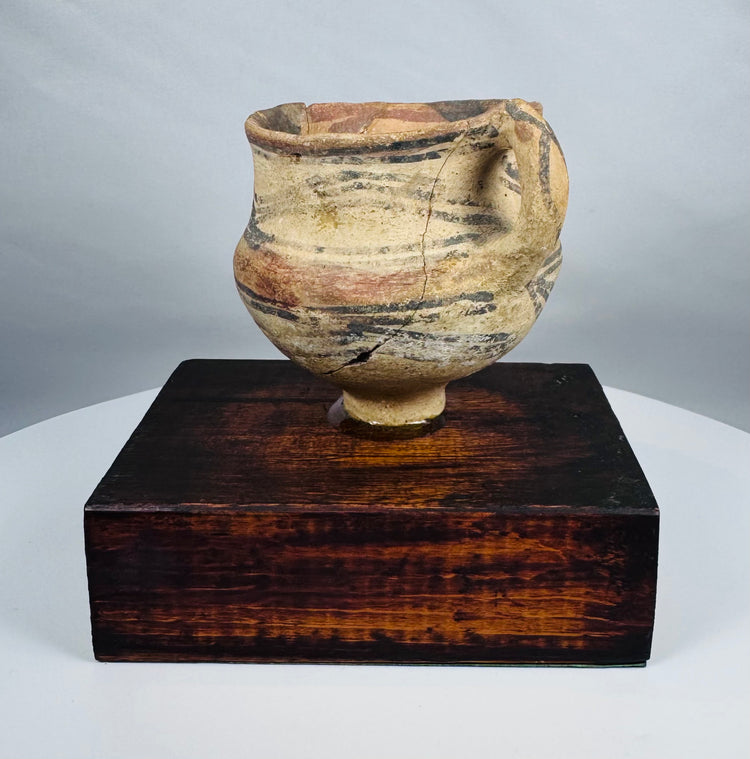 Neolithic Chinese terracotta pottery vessel with painted mineral pigments and strap handle