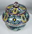 Traditional Moroccan pottery vessel showcasing hand-painted floral patterns