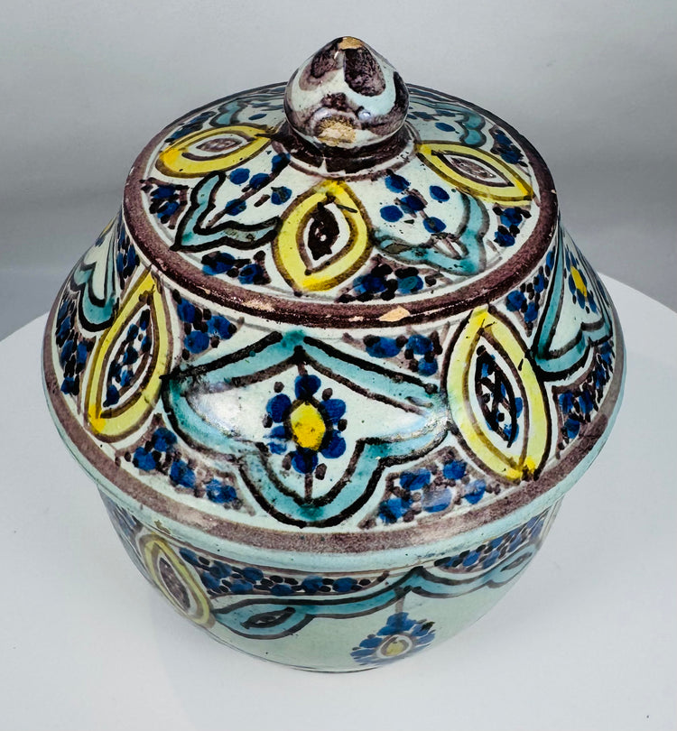 Traditional Moroccan pottery vessel showcasing hand-painted floral patterns