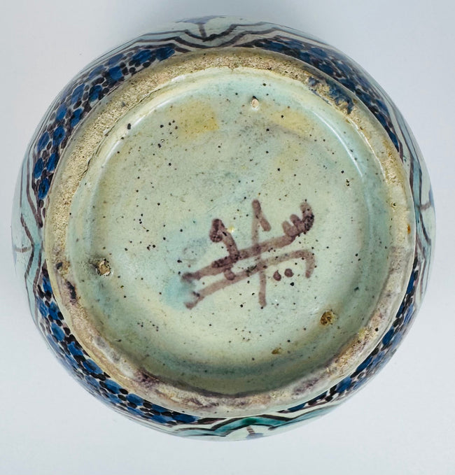 Decorative Fes pottery covered jar with glazed interior and workshop mark