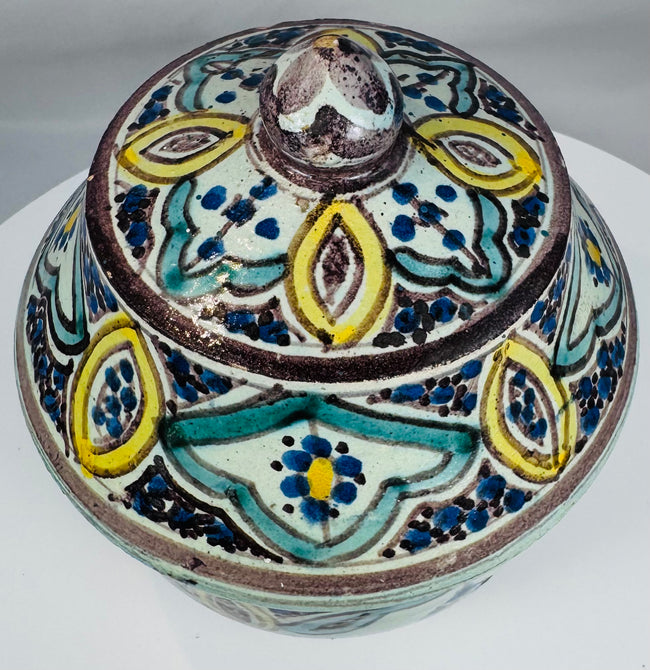 Hand-thrown Moroccan covered pottery jar with traditional Islamic design motifs