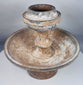 Terracotta ritual stand with mineral deposits and surviving painted decoration