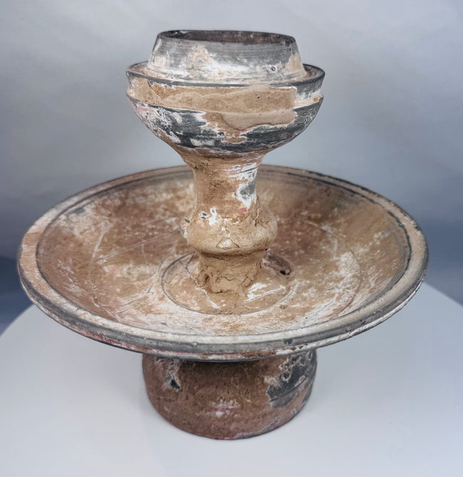 Near Eastern terracotta pedestal lamp or offering vessel with aged encrustation