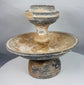 Museum-quality terracotta ritual vessel with pedestal base and architectural form