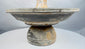 Ancient Mediterranean ceremonial vessel with elevated cup and surrounding catch basin