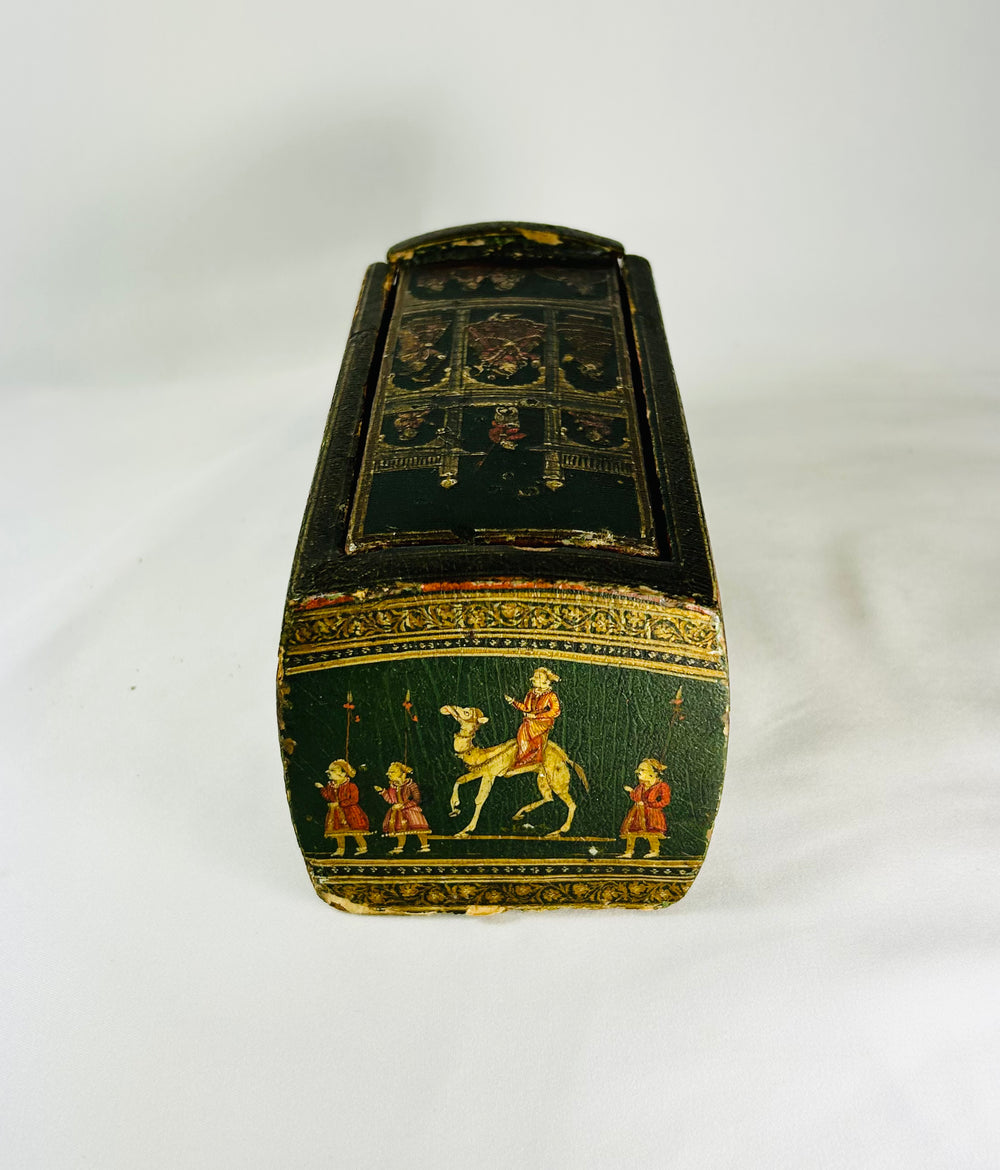 End view of an antique Indian Ganjifa box with miniature figures and decorative borders, photographed against a white backdrop.