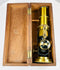 19th century monocular microscope with lacquered brass body and fitted wood case