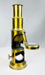 19th century portable brass microscope with mirror base and compact scientific design