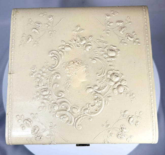 Antique molded case with floral relief and original detachable collars