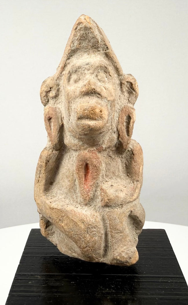 Early Historic Indian terracotta figure depicting a possible deity or devotee, crafted from reddish baked clay with natural earthen accretions.