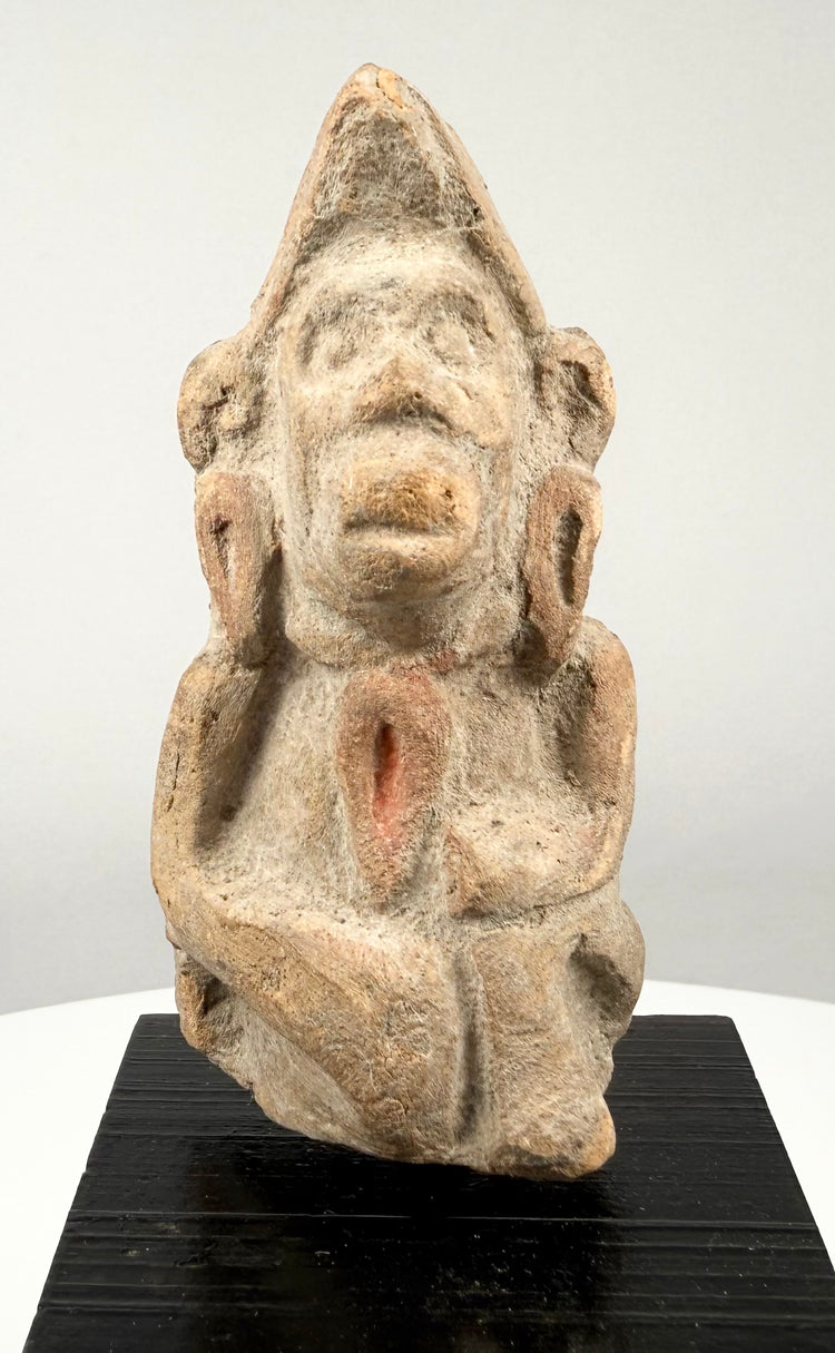 Early Historic Indian terracotta figure depicting a possible deity or devotee, crafted from reddish baked clay with natural earthen accretions.