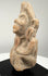 Ancient Northern Indian clay figurine with an elongated head, simplified body proportions, and weathered terracotta surfaces.