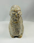 Hand carved stone effigy from West Africa with elongated body and upright neck
