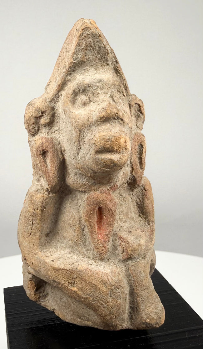 Ancient South Asian terracotta fragment representing a possible deity or worshipper, with weathered facial details and minor surface chipping.
