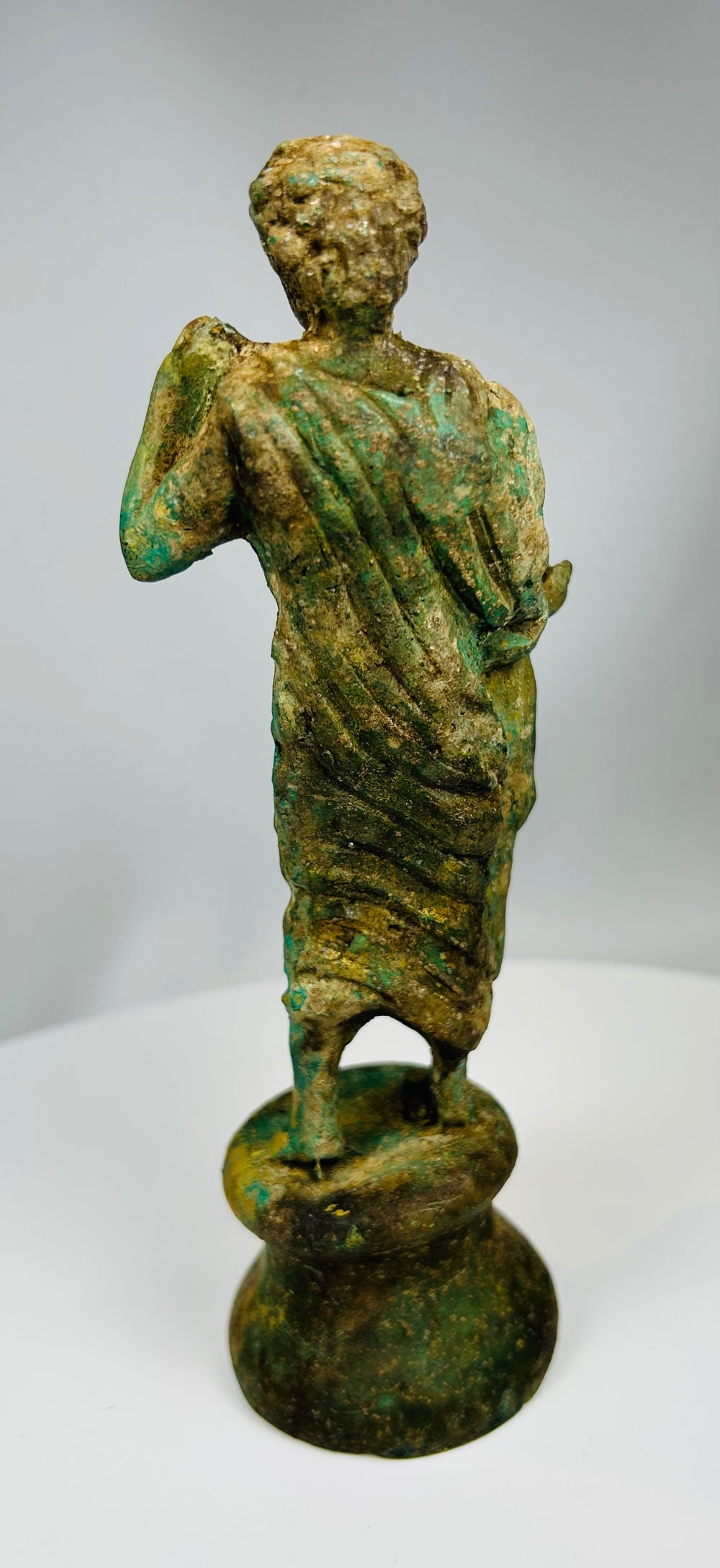 Neoclassical bronze sculpture with contrapposto stance and drapery