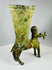 Antique mythological bronze vessel with aged patina and classical design
