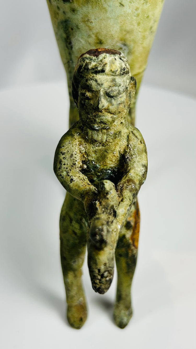 Decorative antique bronze rhyton with oxidized surface and mythic figure