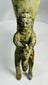 Decorative antique bronze rhyton with oxidized surface and mythic figure