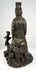 Rear view of antique bronze Bodhisattva crown and geometric robe detailing