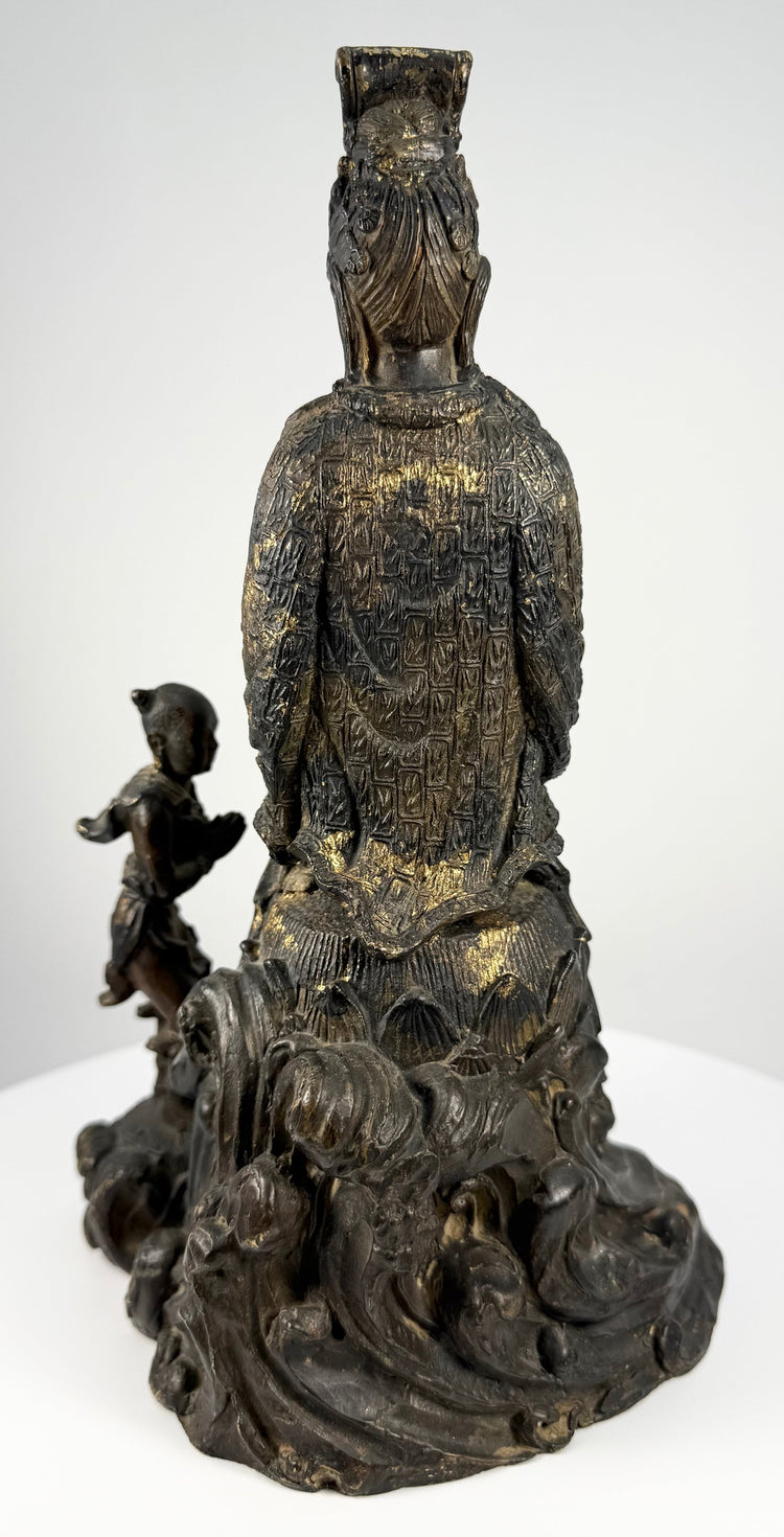 Rear view of antique bronze Bodhisattva crown and geometric robe detailing