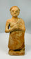 Hand-modeled terracotta figure in folk art style