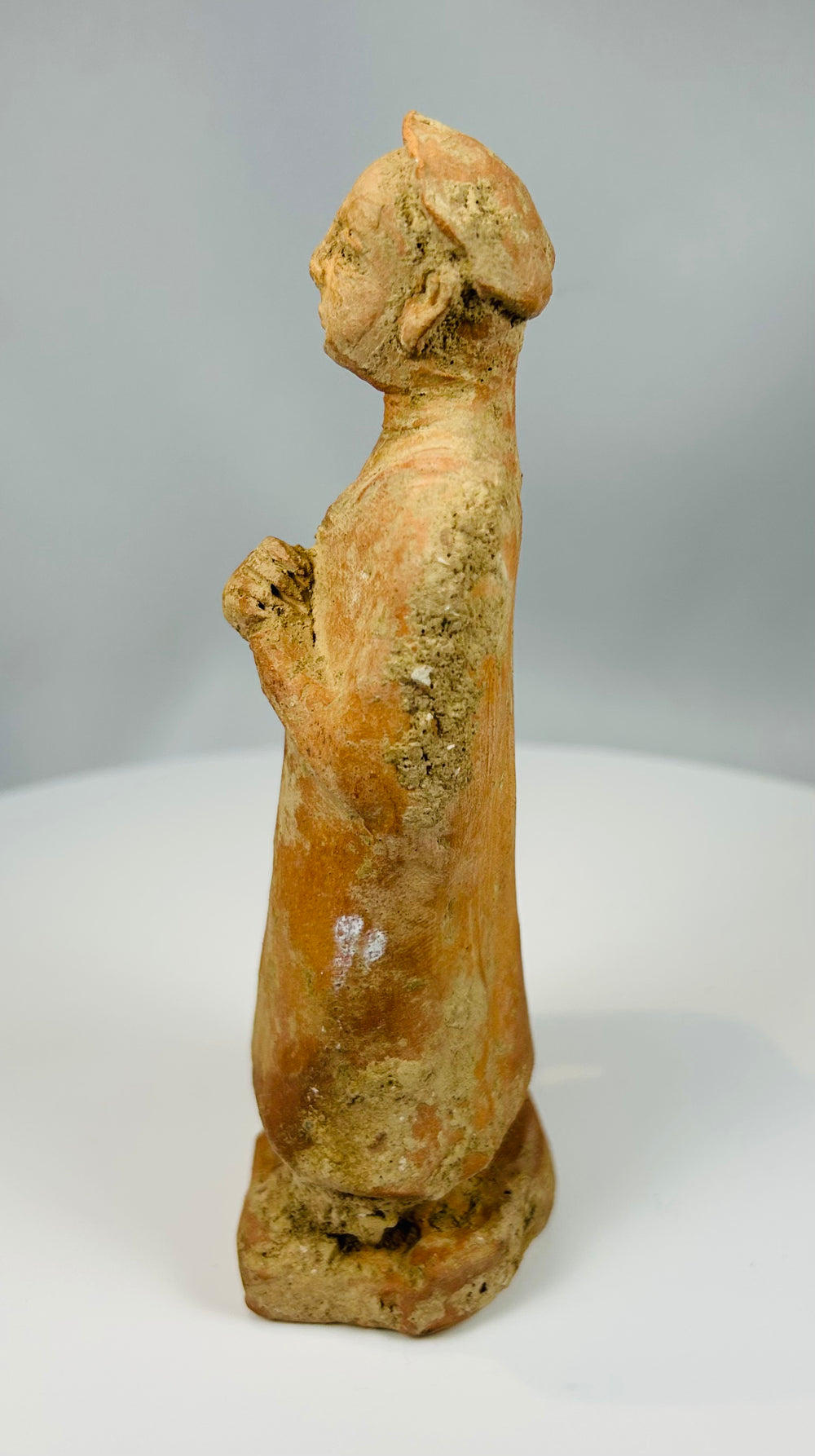 European terracotta figure with clasped hands and base