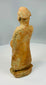 Rustic earthenware figure with weathered surface texture