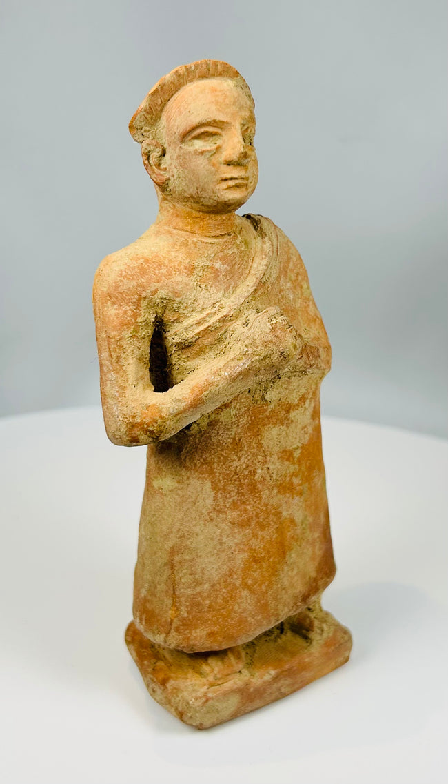 Decorative terracotta figure with aged patina and texture