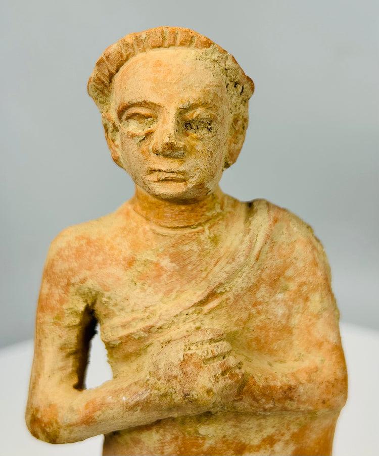 Vintage terracotta folk art figure with weathered finish