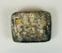 Antique carved stone block with abstract geometric design and patina