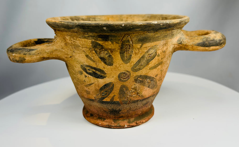 Terracotta skyphos from ancient Italy with painted floral motif