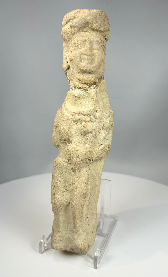 Near Eastern clay figurine with stylized female form and headdress