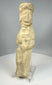 Near Eastern clay figurine with stylized female form and headdress