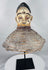 African Yoruba ancestor masquerade headdress displaying carved wood construction and surviving wicker costume framework.