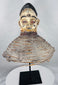 African Yoruba ancestor masquerade headdress displaying carved wood construction and surviving wicker costume framework.