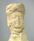 Terracotta votive figure with pale clay surface and age wear