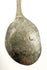 Detailed view of an ancient Roman dining utensil featuring dark green and brown bronze patination.