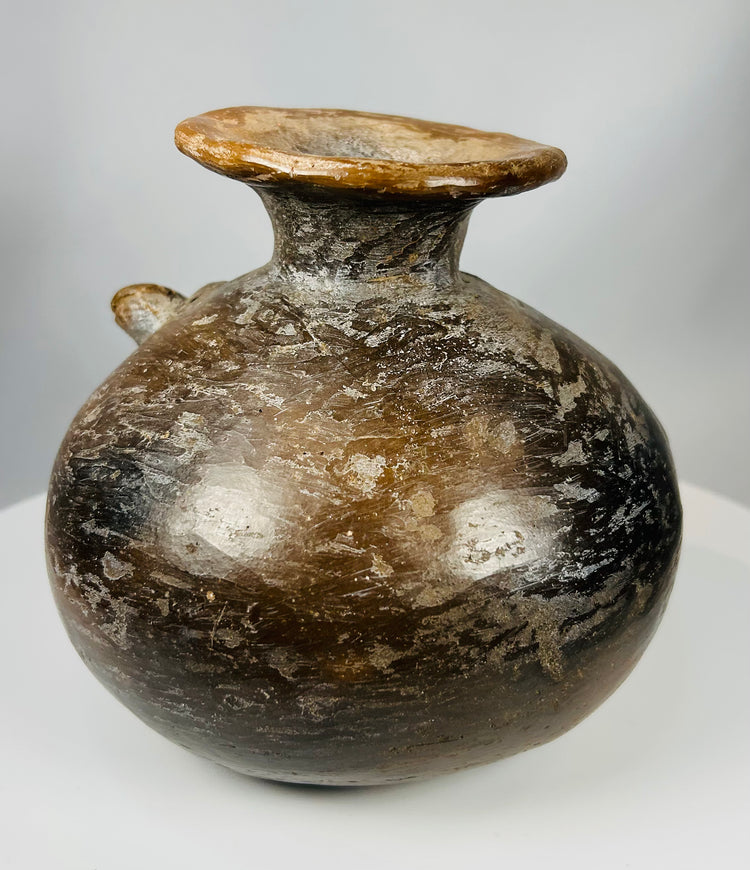 Pre-Columbian effigy vessel with crocodile forms and flared rim