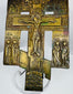 Imperial Russian bronze devotional cross displaying Christ crucified, saints, and traditional Orthodox iconography.